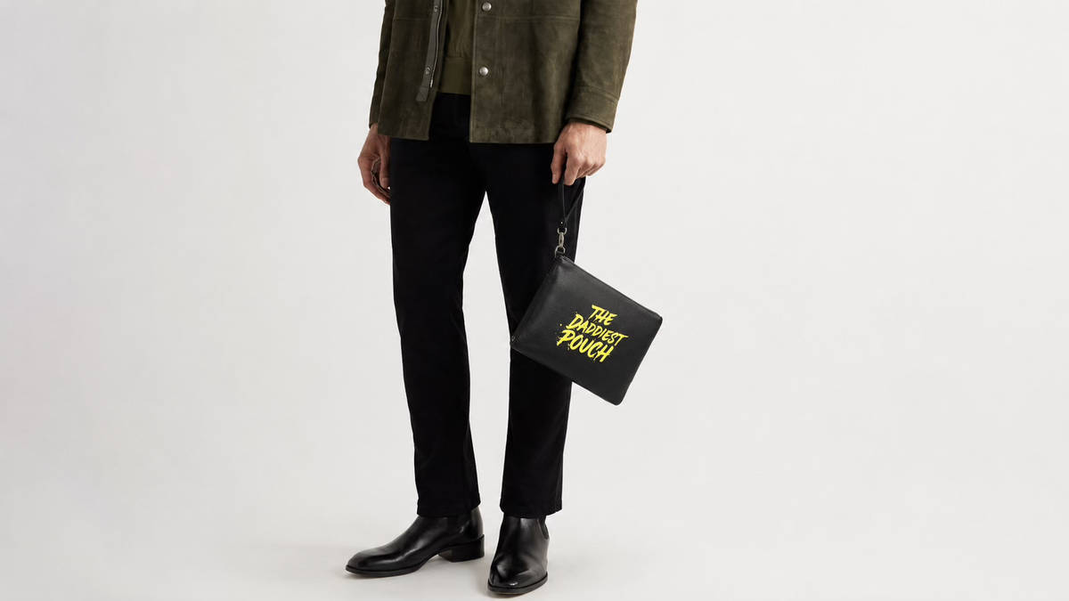 A dad holding The Daddiest Pouch